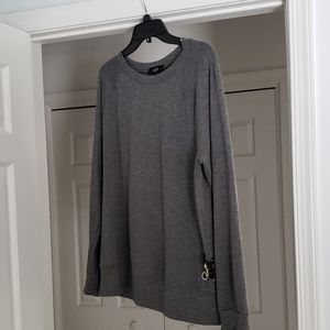 AGB grey sweatshirt with ties on side.